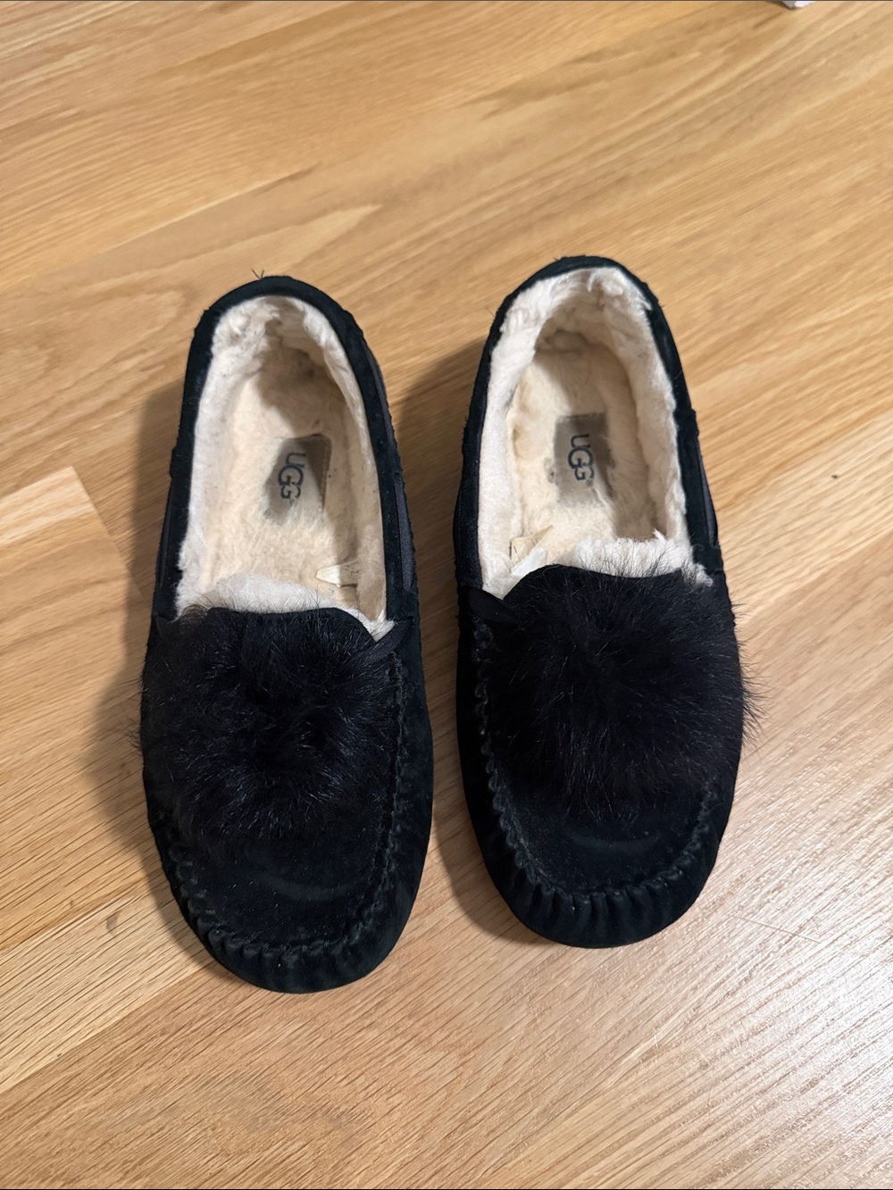 UGG Women's Black Suede Pom Pom Moccasins